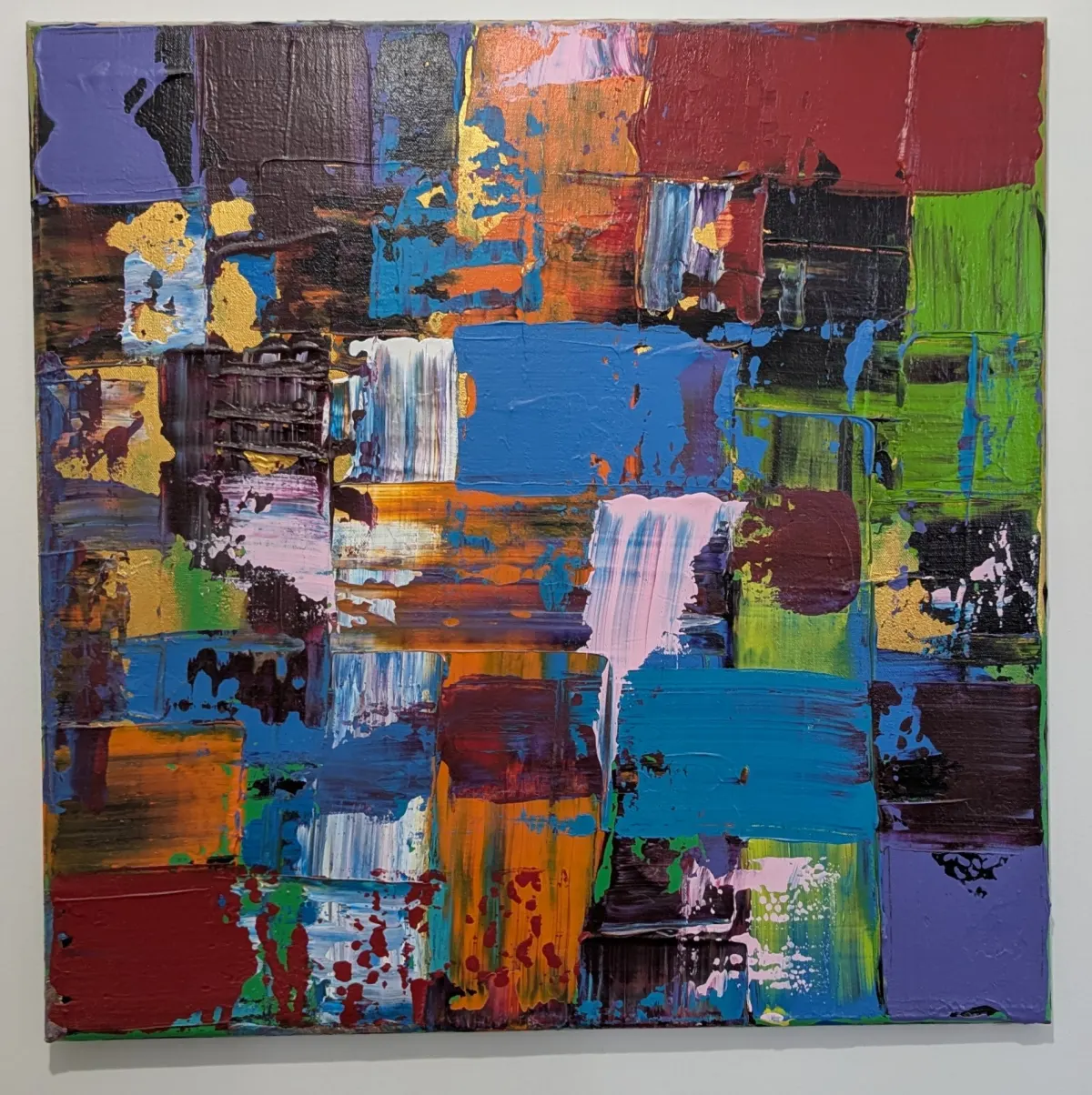 Dense abstract painting assembled from blue, green, burgundy, orange, pink, and purple blocks.