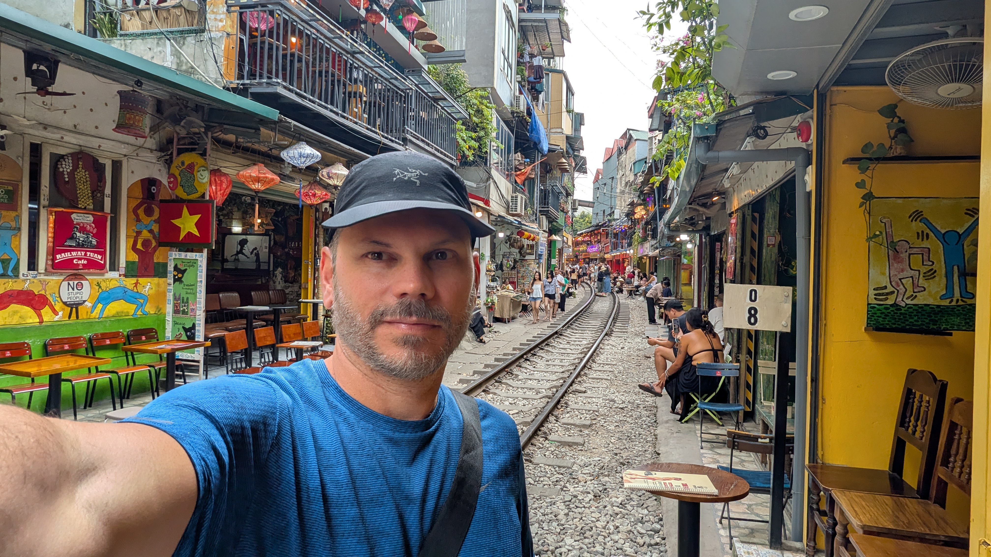 Felipe beside the railway tracks on Hanoi’s Train Street, Vietnam.
